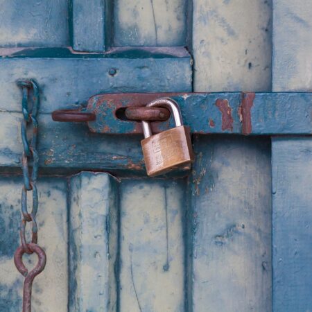 gold padlock locking door