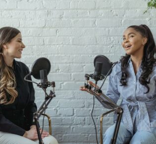 positive black woman talking to radio host